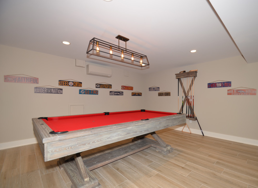 Example of a large transitional walk-out porcelain tile and brown floor basement design in New York with gray walls and no fireplace