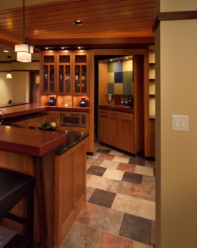 Basement - craftsman underground ceramic tile and multicolored floor basement idea in Minneapolis with beige walls and a bar