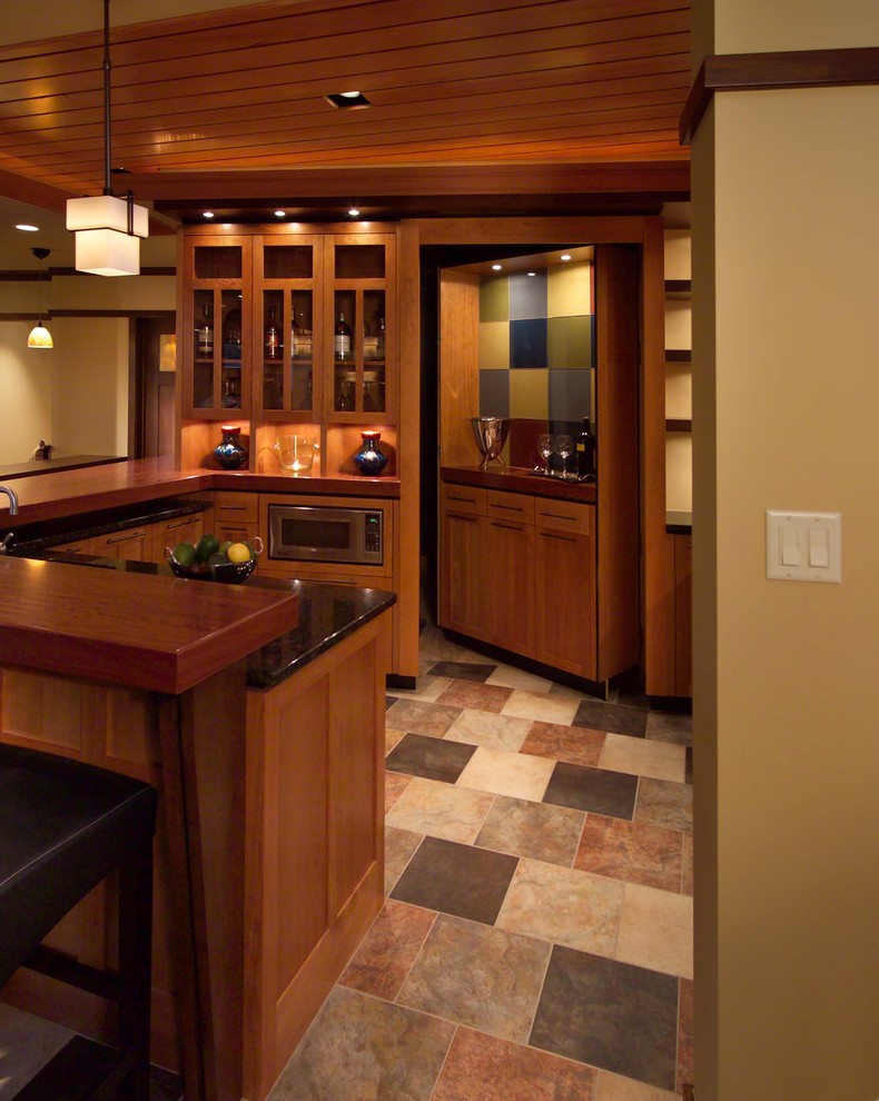 Home bar - craftsman ceramic tile and multicolored floor home bar idea in Minneapolis