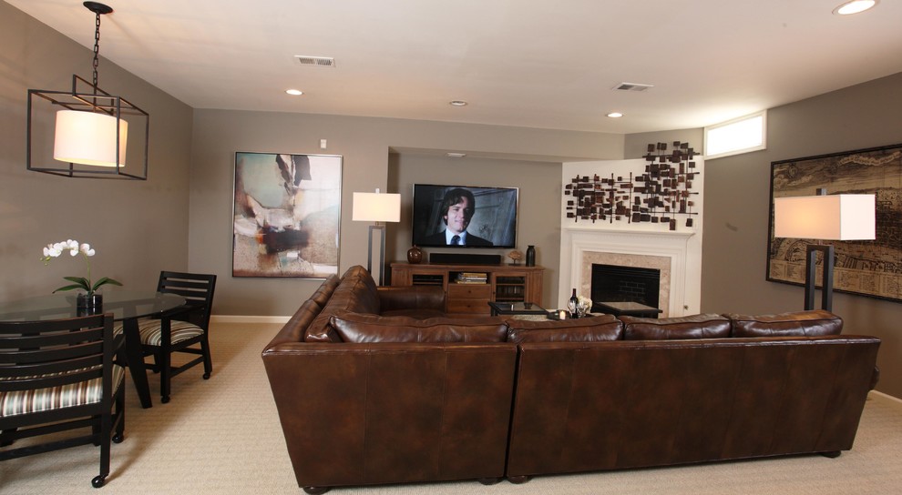 Basement - transitional carpeted basement idea in New York with gray walls, a standard fireplace and a tile fireplace