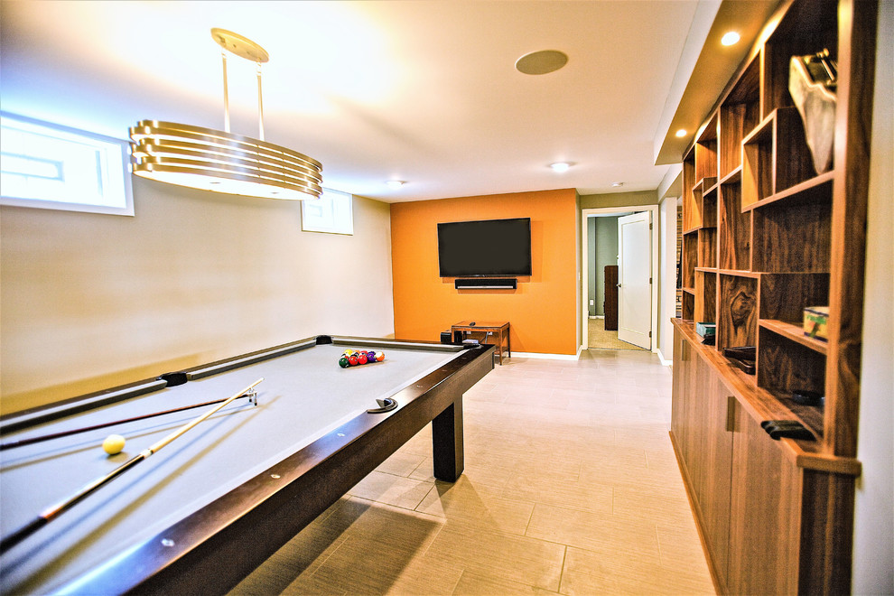 Retro basement in Minneapolis with vinyl flooring, a standard fireplace, a stone fireplace surround and beige floors.