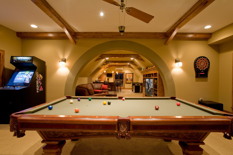 This is an example of a classic look-out basement in Minneapolis with beige walls and carpet.