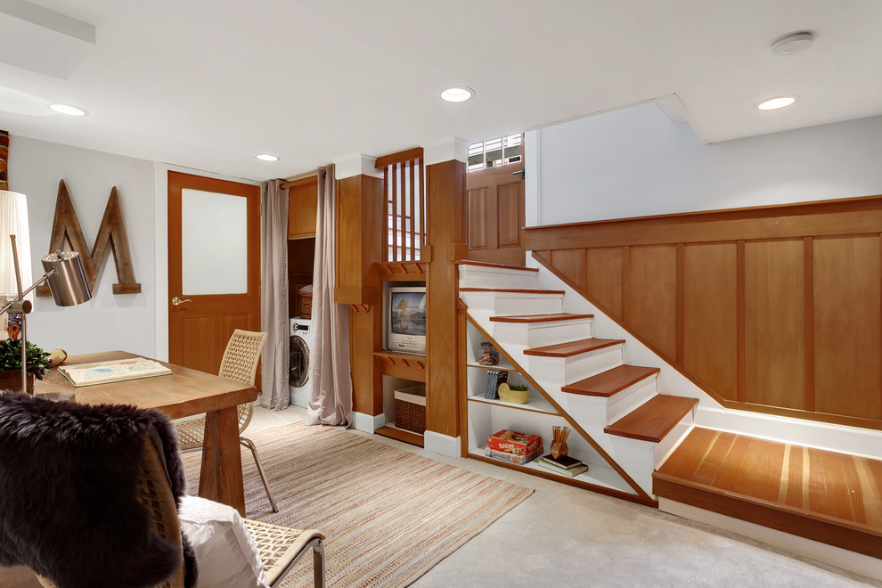 Classic basement in Seattle with grey walls, carpet, grey floors, no fireplace and a dado rail.