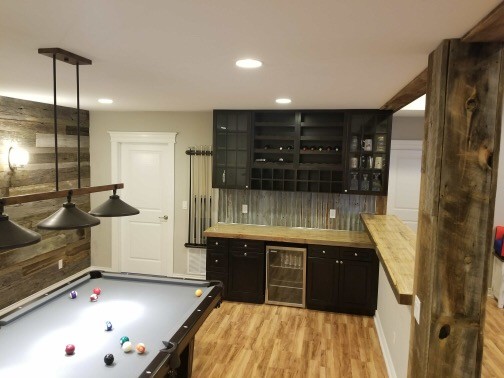Example of a mid-sized mountain style basement design in Denver