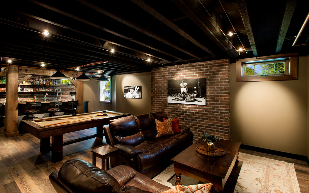 Inspiration for a large rustic look-out basement in Seattle with beige walls and dark hardwood flooring.
