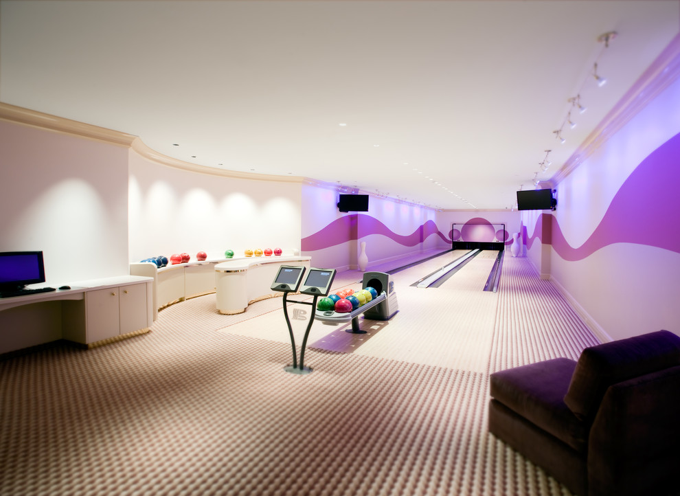 Inspiration for an expansive contemporary fully buried basement in Chicago with purple walls, carpet and no fireplace.