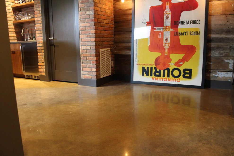 Photo of a large modern look-out basement in Other with beige walls, concrete flooring and yellow floors.