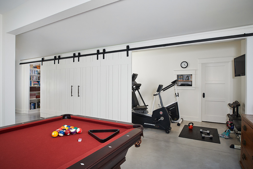 Example of a trendy gray floor and concrete floor basement design in Grand Rapids with white walls