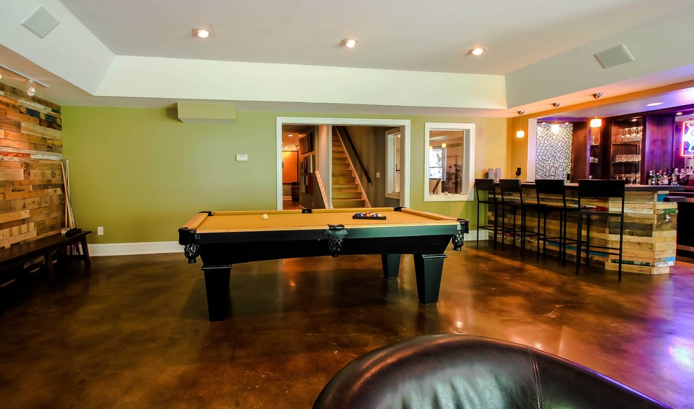 Trendy concrete floor and brown floor family room photo in Atlanta