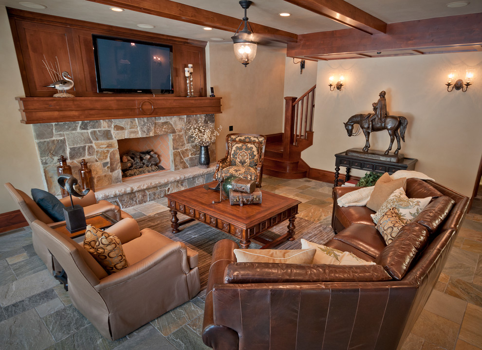 Large traditional fully buried basement in Salt Lake City with beige walls, slate flooring, a standard fireplace and a stone fireplace surround.