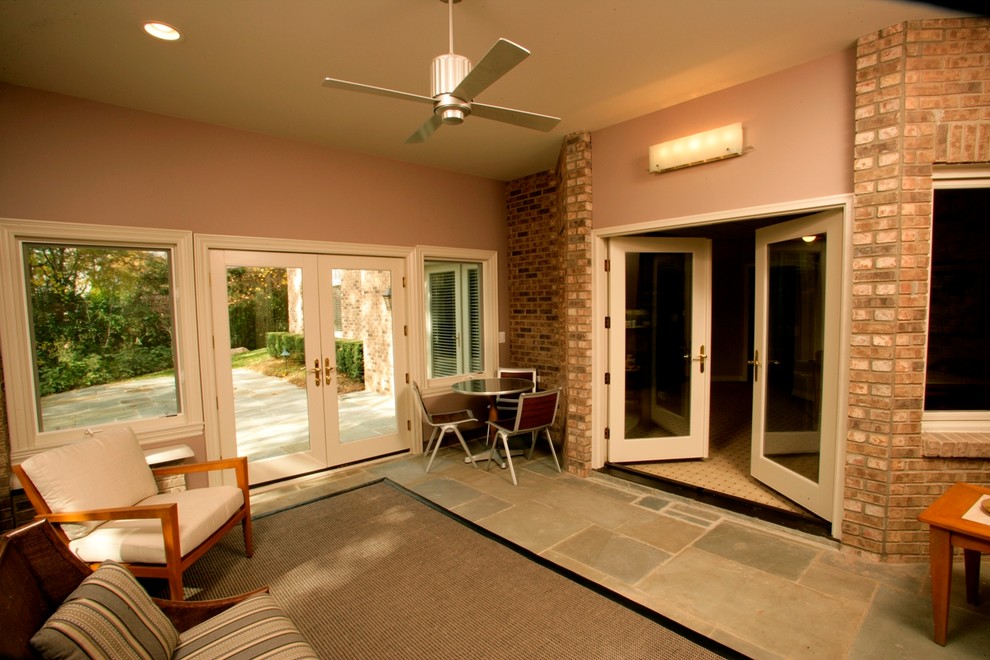 Basement - mid-sized contemporary walk-out slate floor basement idea in Detroit with pink walls and no fireplace