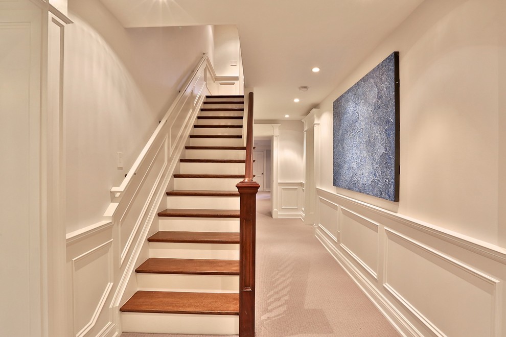 Design ideas for a large contemporary walk-out basement in Toronto with white walls, carpet and no fireplace.
