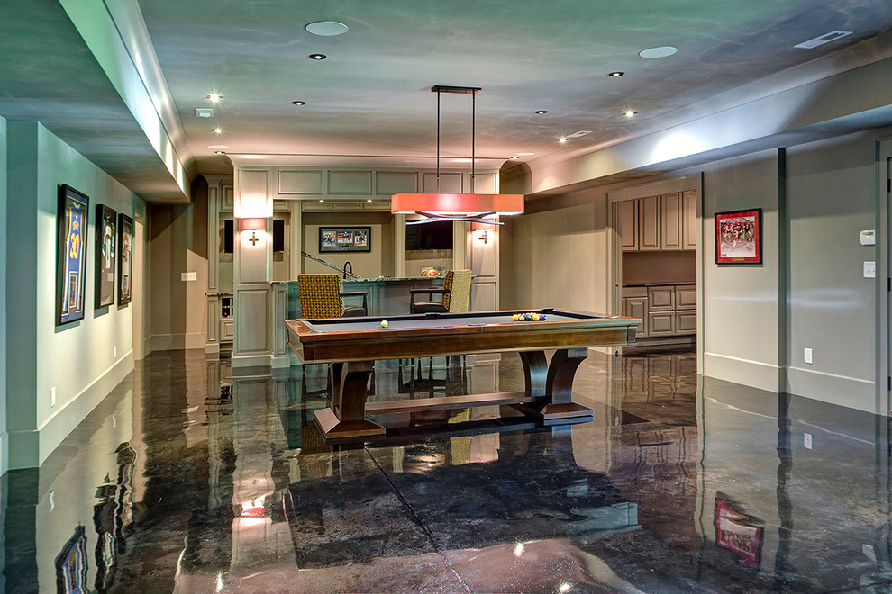 Example of a large trendy walk-out concrete floor basement design in Other with gray walls