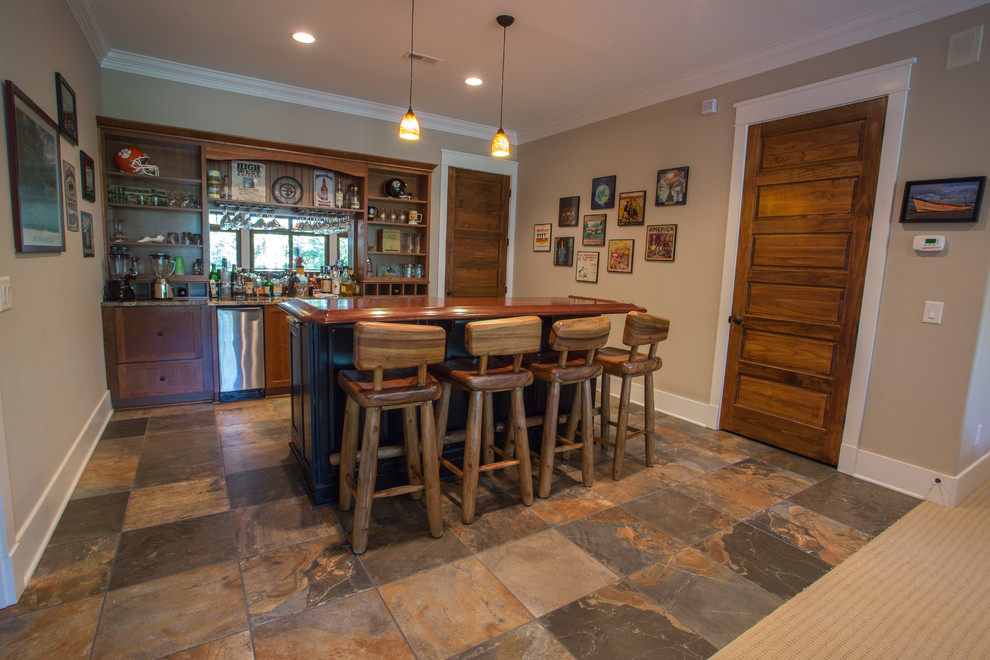 Basement - large craftsman walk-out slate floor basement idea with beige walls and no fireplace
