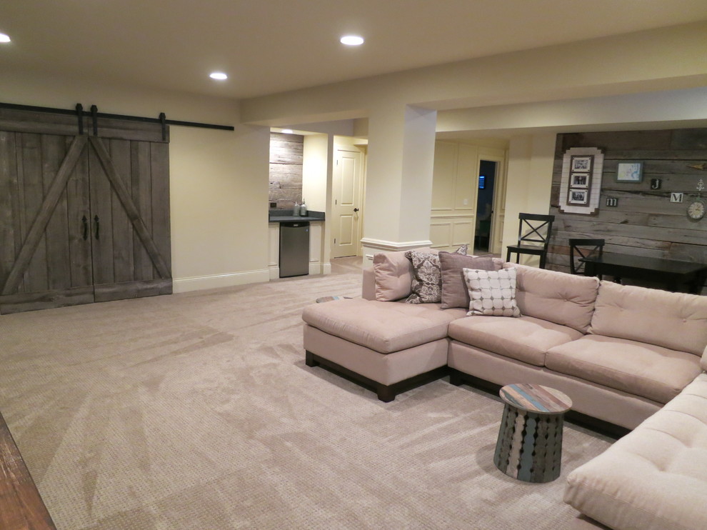Large mountain style look-out carpeted basement photo in Chicago with beige walls and no fireplace