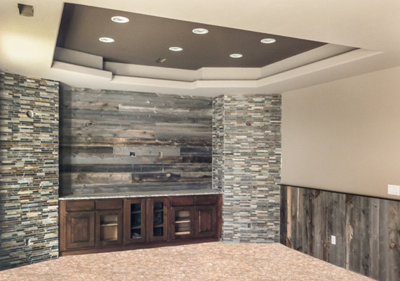 Inspiration for a mid-sized rustic underground carpeted basement remodel in Denver with beige walls and no fireplace