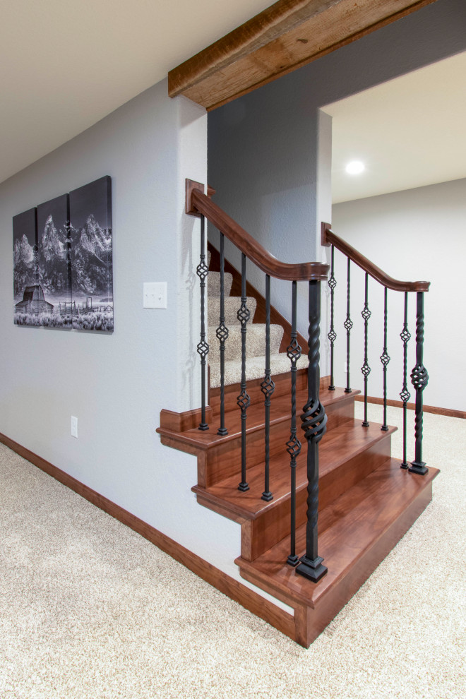 Expansive classic staircase in Milwaukee with wood walls.