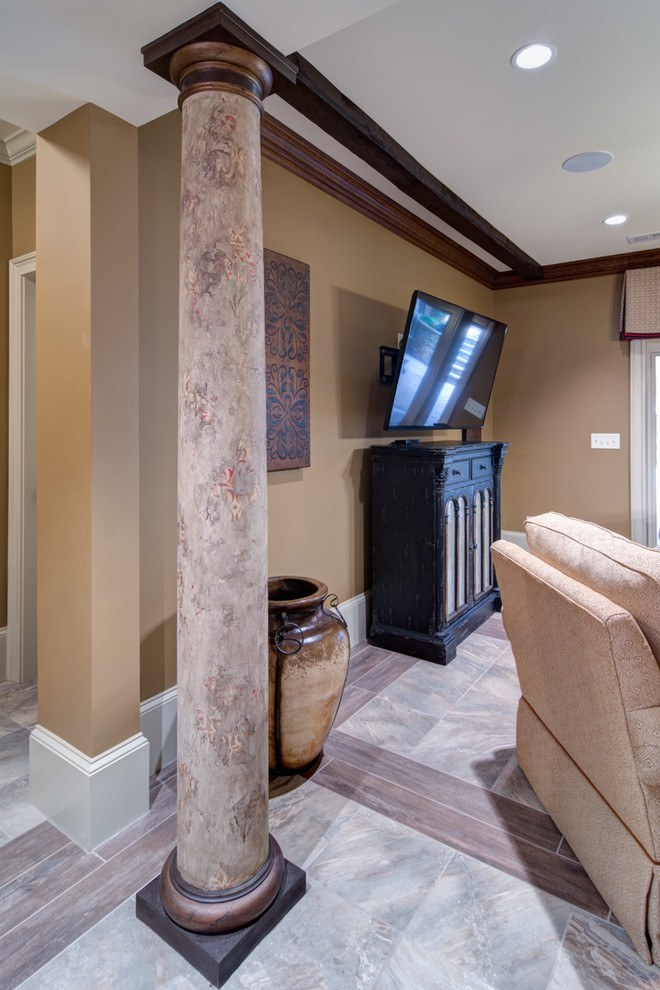 Basement - large mediterranean walk-out porcelain tile and beige floor basement idea in Atlanta with brown walls, a standard fireplace and a stone fireplace