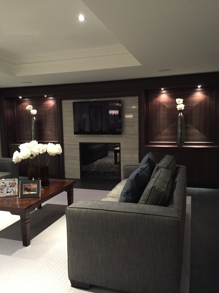 Photo of a medium sized traditional basement in Toronto with a standard fireplace and a tiled fireplace surround.