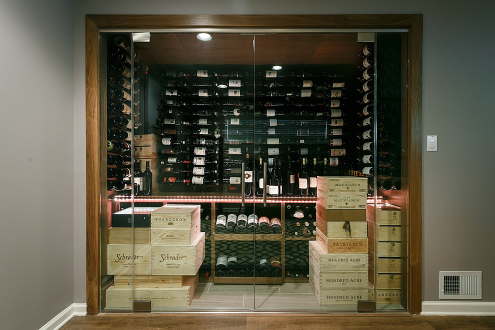 Inspiration for a medium sized modern wine cellar in New York with porcelain flooring and beige floors.
