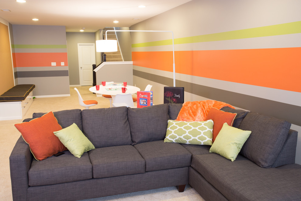 Example of a large trendy underground carpeted basement design in DC Metro with multicolored walls and no fireplace