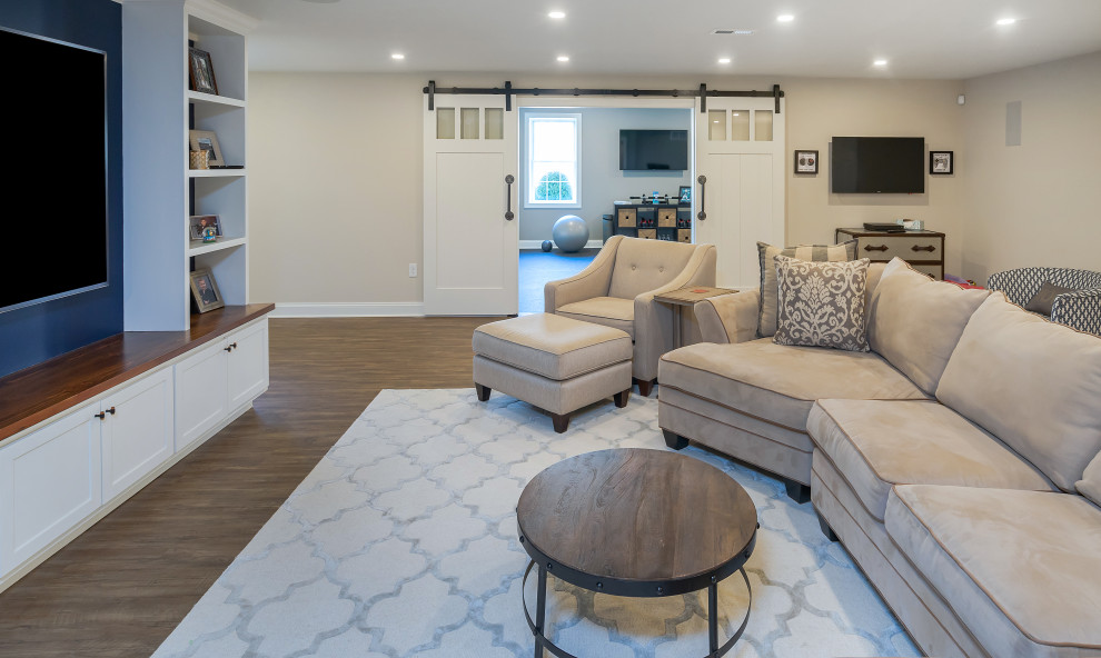 Basement - huge cottage walk-out medium tone wood floor and brown floor basement idea in Philadelphia with gray walls