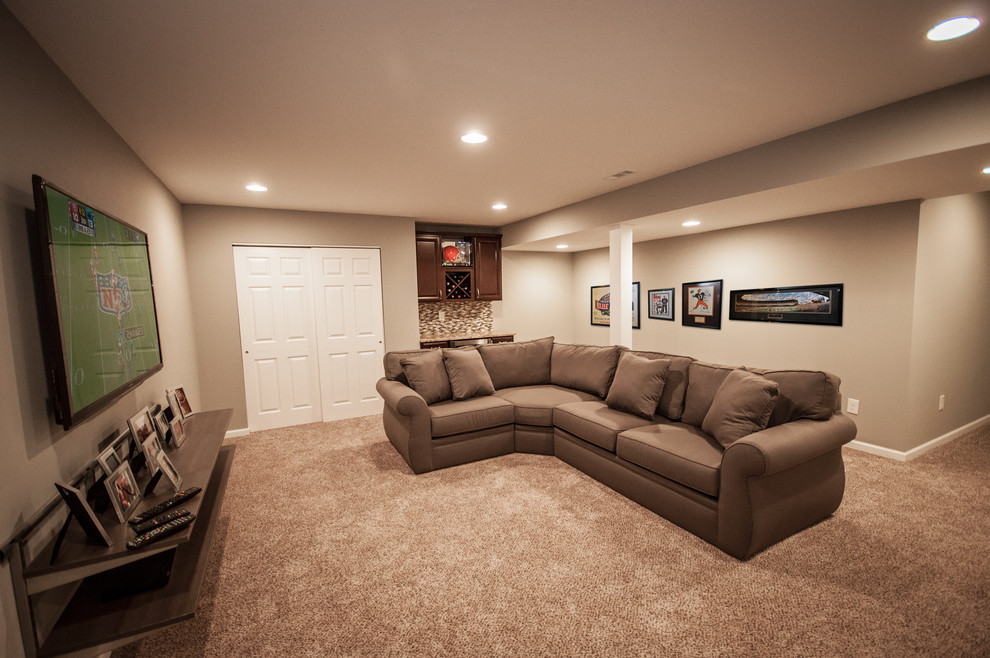 Example of a mid-sized transitional carpeted and brown floor basement design in Columbus with brown walls and no fireplace