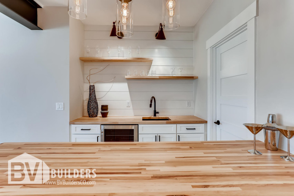 Photo of a country kitchen in Denver with porcelain flooring and grey floors.