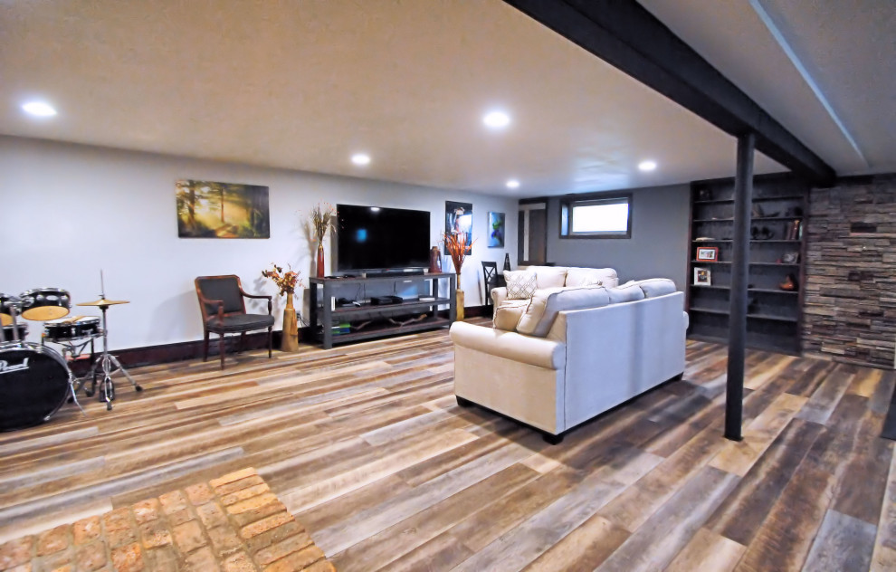 Medium sized urban look-out basement in New York with white walls, vinyl flooring, no fireplace and multi-coloured floors.