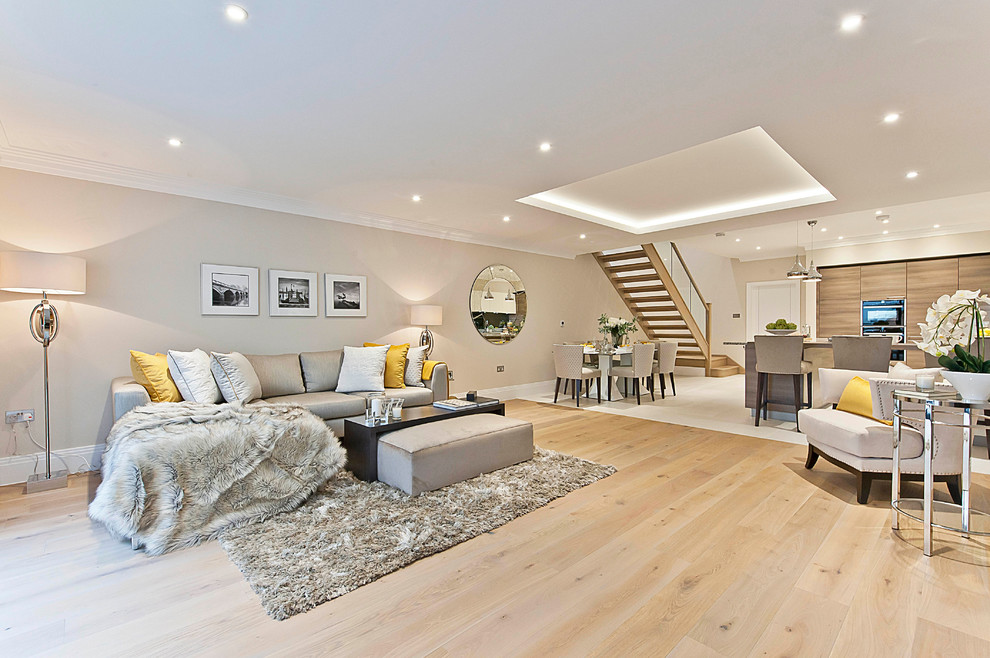 Basement - transitional walk-out light wood floor basement idea in Surrey