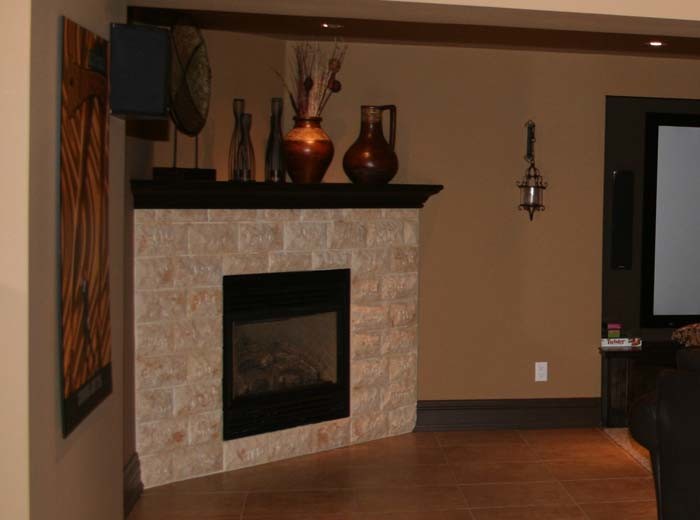 Stone faced gas fireplace Basement Toronto by Harlequin Homes Houzz