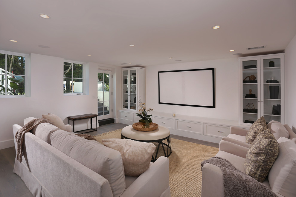 This is an example of a medium sized traditional look-out basement in Los Angeles with white walls.