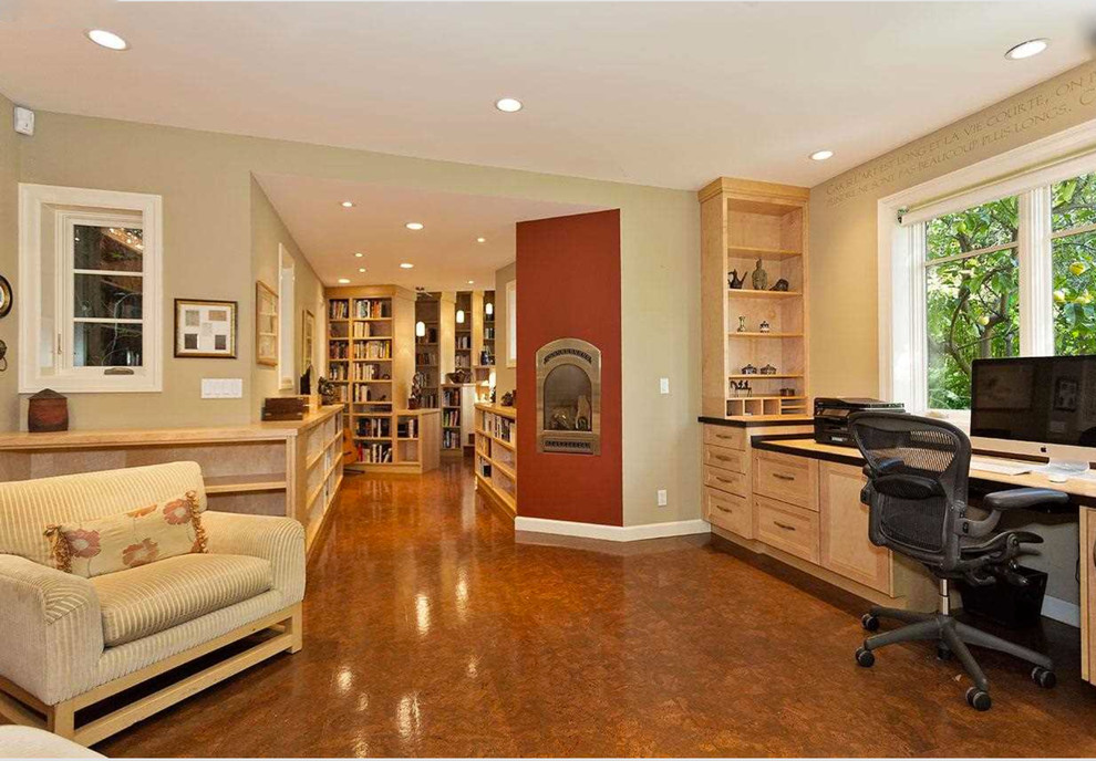 Photo of a large contemporary home office in San Francisco with a corner fireplace.
