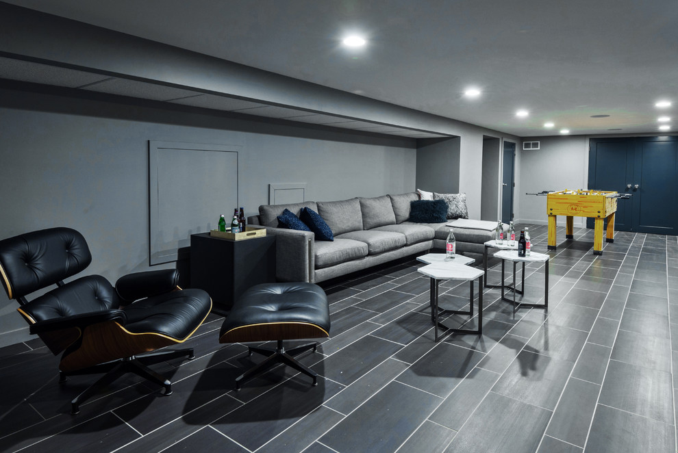 Basement - mid-sized modern underground porcelain tile basement idea in Philadelphia with gray walls and no fireplace