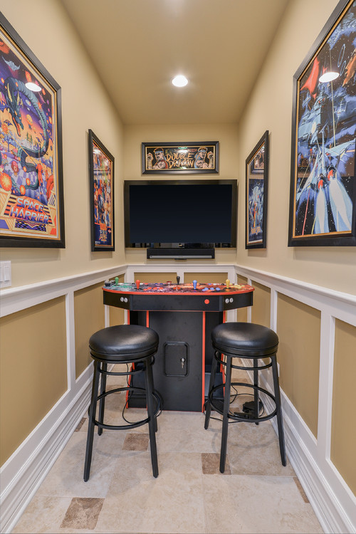 Game room - traditional enclosed game room idea in Chicago with beige walls and a wall-mounted tv 