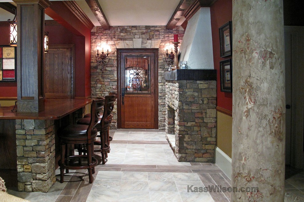 Inspiration for a large timeless basement remodel in Atlanta with red walls, a standard fireplace and a stone fireplace