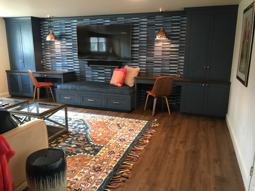 Inspiration for a large transitional walk-out vinyl floor, brown floor and wallpaper basement game room remodel in Boston with blue walls