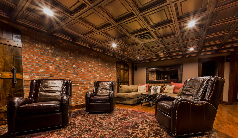 Example of a large mountain style underground medium tone wood floor basement design in New York with beige walls and no fireplace