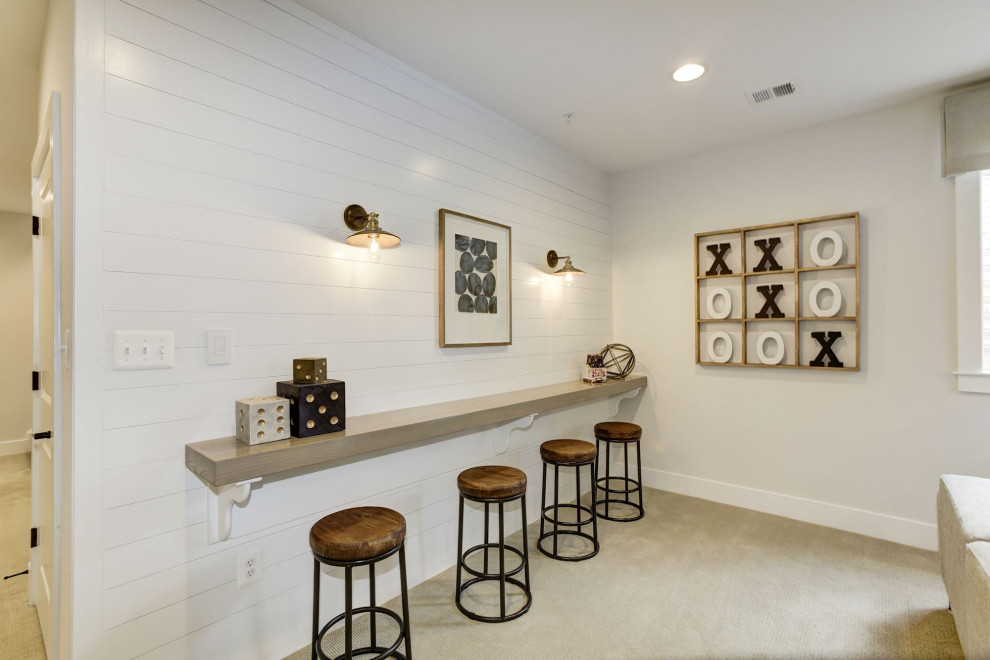 Basement - large transitional look-out carpeted, beige floor and shiplap wall basement idea in DC Metro with a bar, white walls and no fireplace