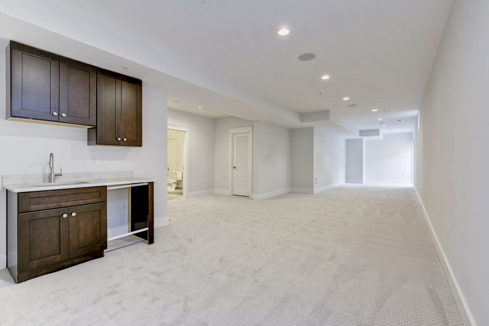 Inspiration for a large traditional walk-out basement in DC Metro with beige walls, carpet and white floors.