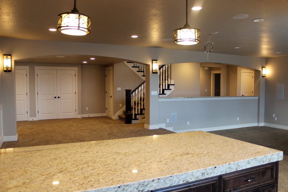 Basement - large traditional walk-out carpeted basement idea in Salt Lake City with gray walls
