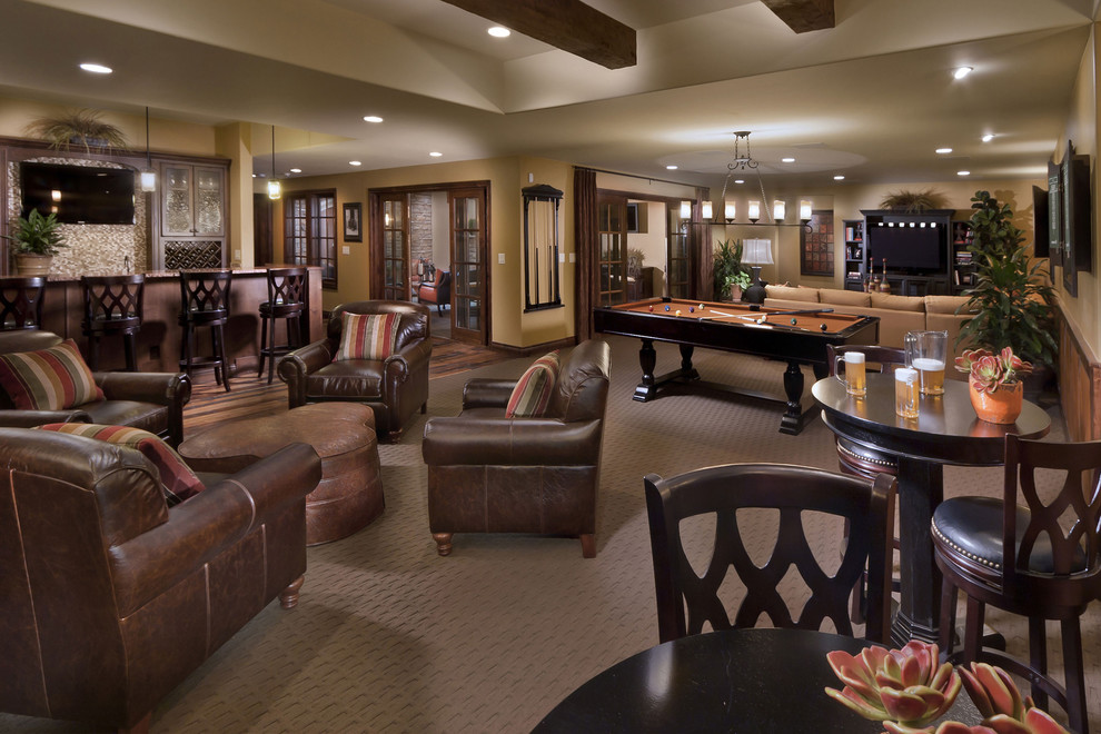 Tuscan walk-out carpeted basement photo in Denver with beige walls and no fireplace