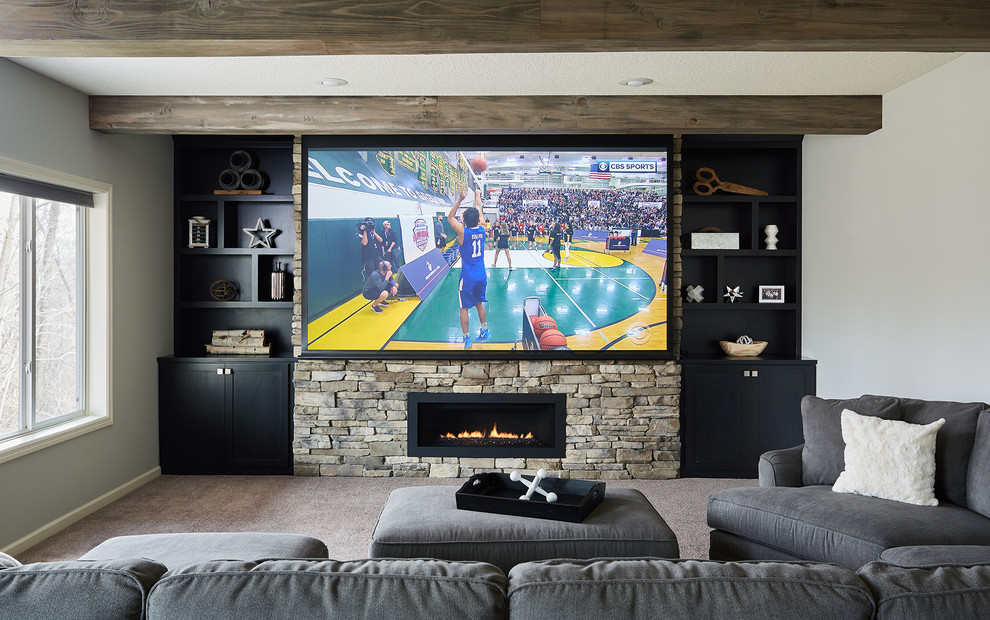 Medium sized traditional walk-out basement in Minneapolis with grey walls, carpet, a stone fireplace surround, grey floors and a ribbon fireplace.