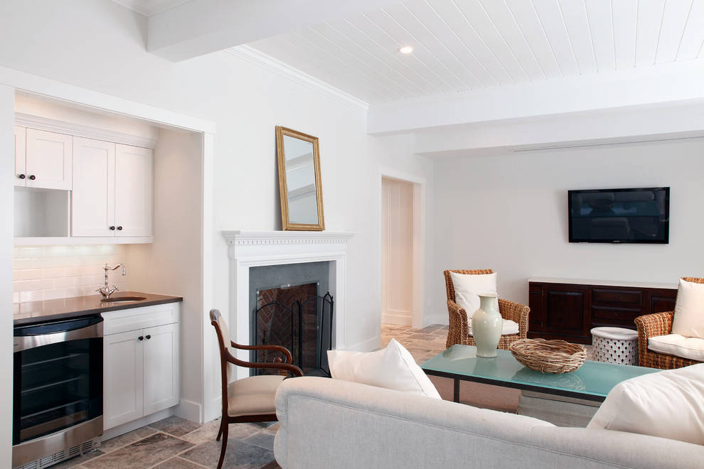 Traditional basement in Manchester with white walls, a standard fireplace and ceramic flooring.