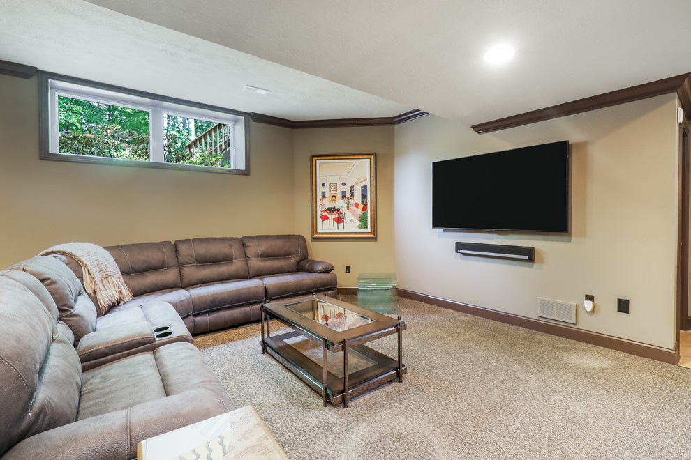 Inspiration for a large classic look-out basement in Cleveland with beige walls, carpet and beige floors.
