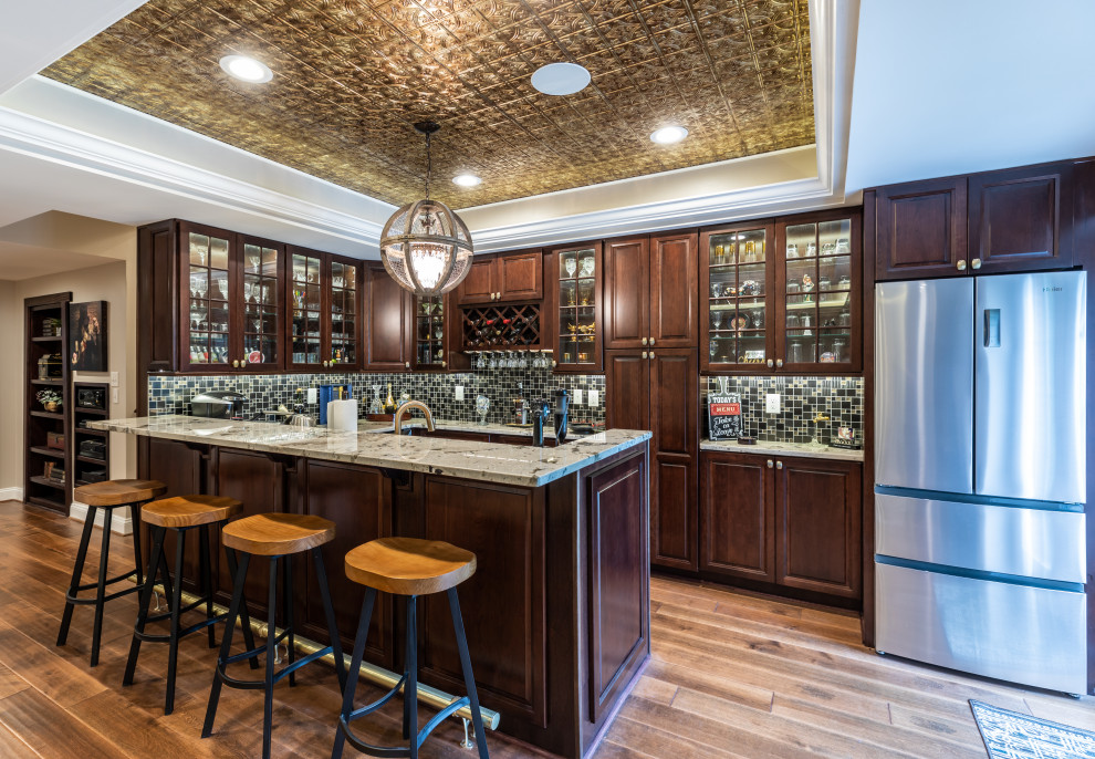 Inspiration for a large contemporary walk-out brown floor, tray ceiling and wainscoting basement remodel in DC Metro with a home theater and a standard fireplace