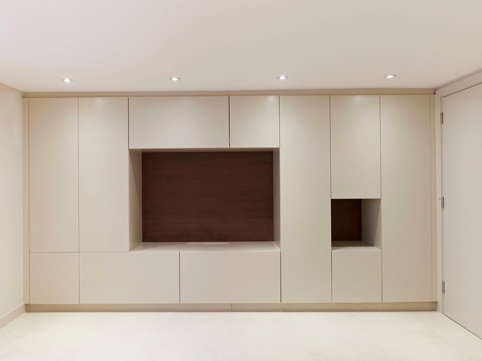 Inspiration for a large contemporary walk-out basement remodel in London with white walls