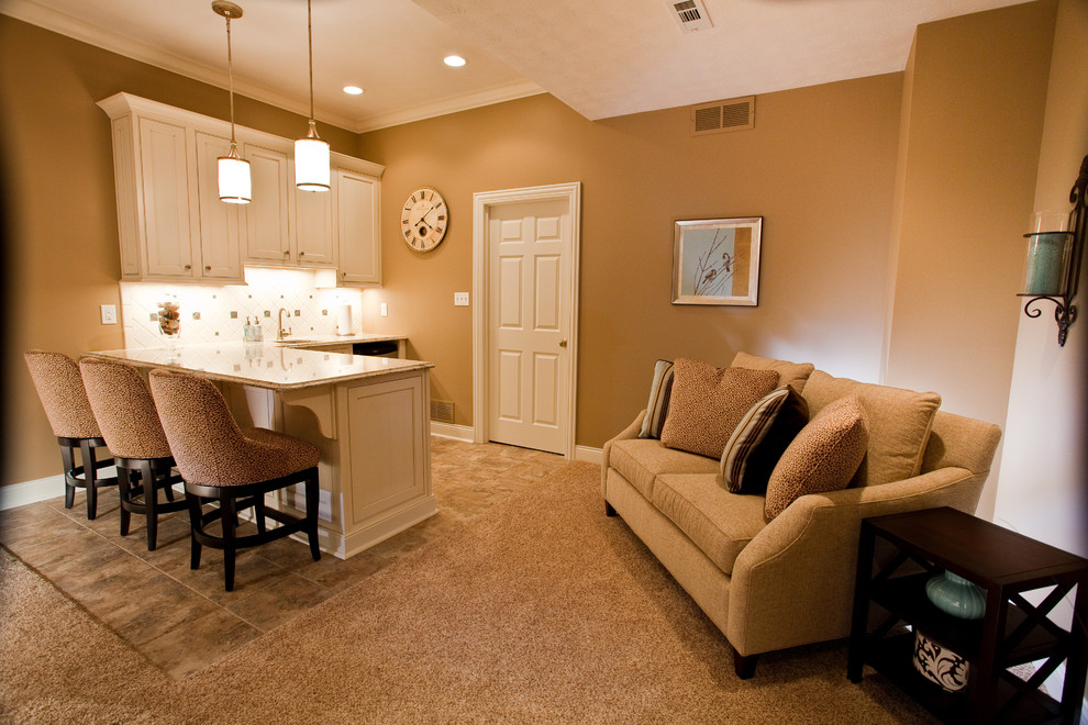 Medium sized classic look-out basement in Indianapolis with beige walls, no fireplace, beige floors and carpet.