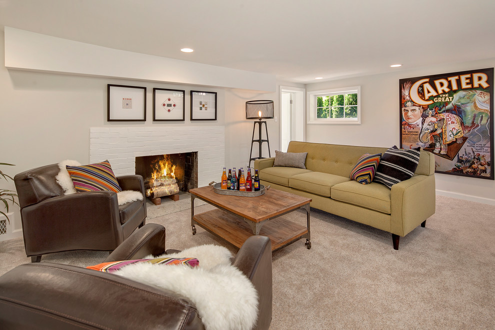 Example of a large beach style walk-out carpeted basement design in Seattle with a standard fireplace, a brick fireplace and gray walls