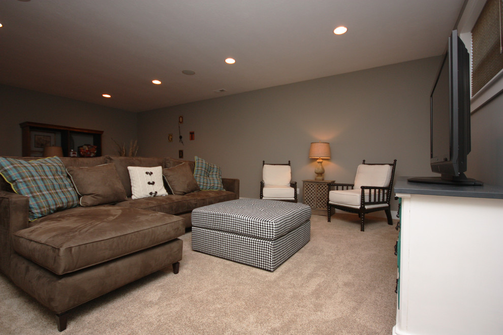 Example of a transitional look-out carpeted basement design in Indianapolis with gray walls